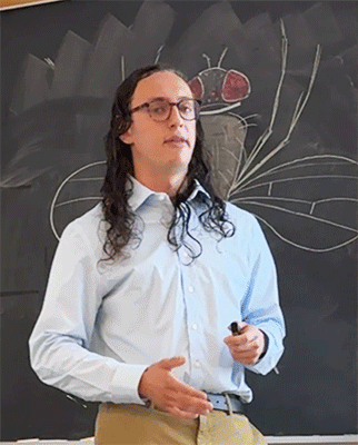 Ilan presents their research at honors symposium