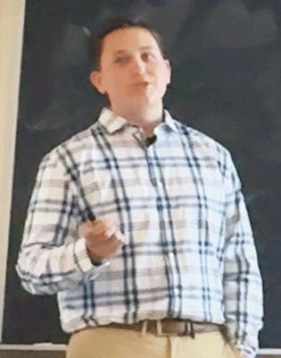Josh presents his research at honors symposium